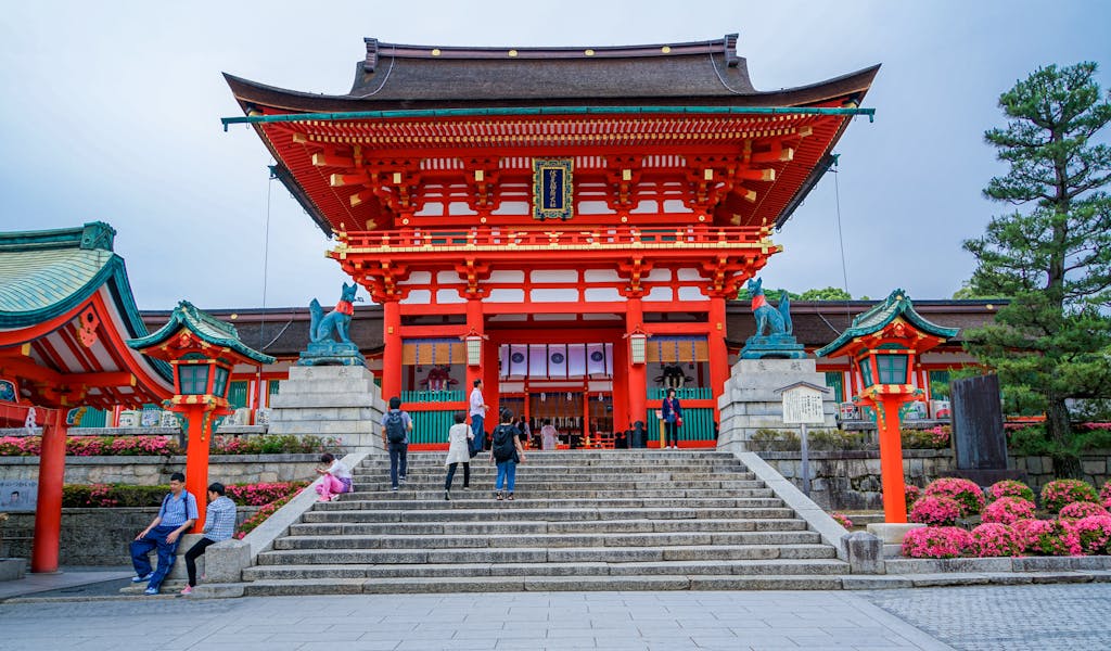 Explore the vibrant architecture of Fushimi Inari Taisha Shrine in Kyoto, Japan.